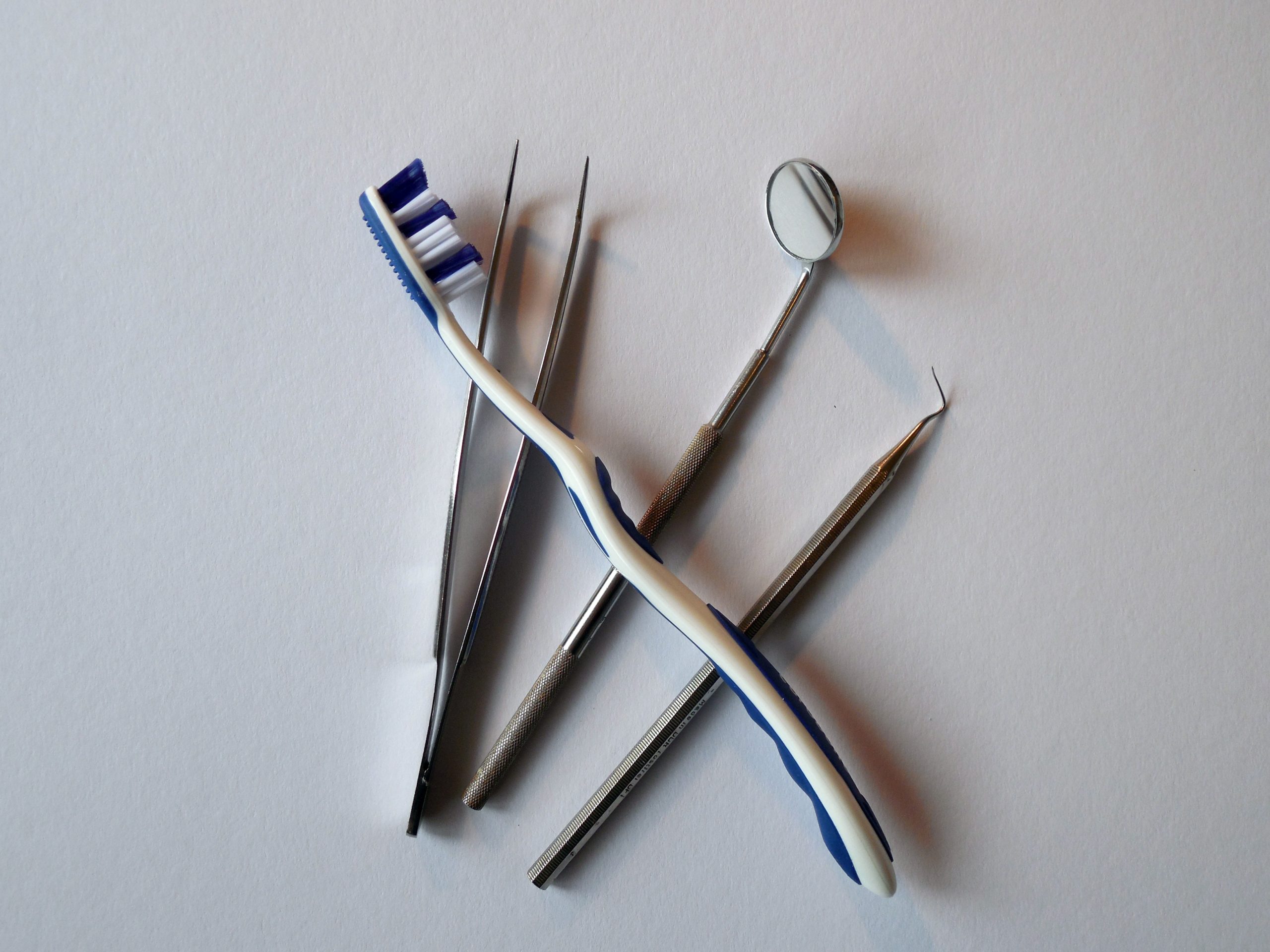 a toothbrush and dental tools
