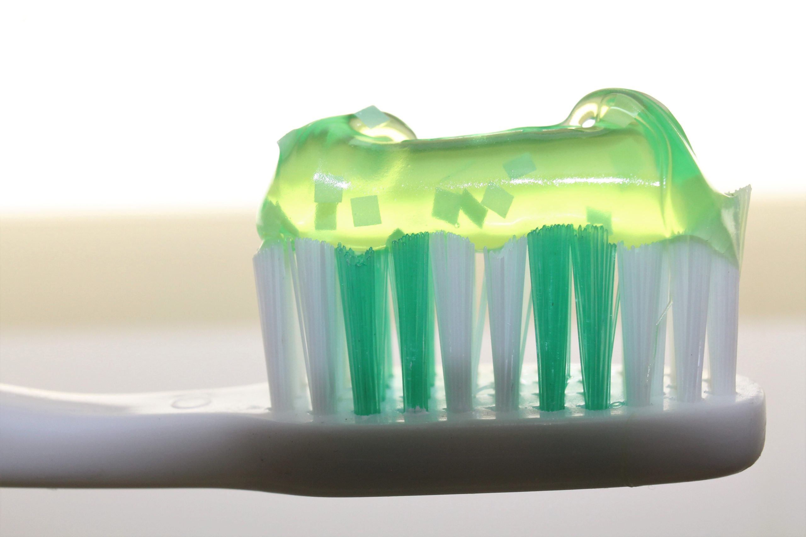 a toothbrush with green gel on it